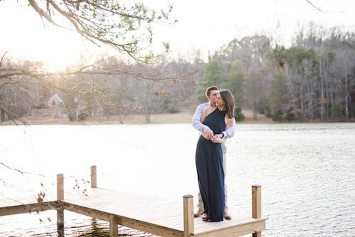 A gorgeous engagement photo on a dock of a lake in a great location in CT
