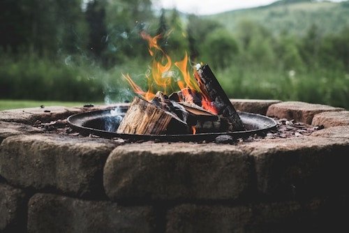 Bonfire in the background of a historic inn in Manchester Village