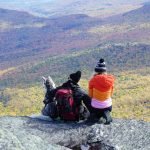 Couple enjoying romantic getaways in Vermont, full of gorgeous views on hiking trails