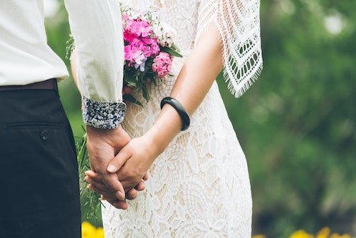 Bed And Breakfast Wedding Venues: Most Unique &Amp; Charming Spot 4 A bride and groom exchanging vows in a rustic barn at a bed and breakfast venue