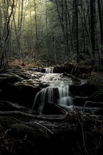 falls over rocky terrain in the forests surrounding Manchester, Vermont