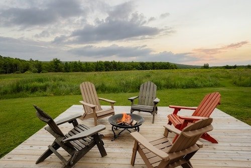 Cozy deck of a cabin with three bedrooms and spectacular views in Livingston Manor