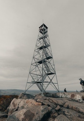 View of the Beacon fire tower from one of the best hikes in upstate New York in winter