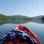 Kayaking on a New York State lake on a Catskills vacation