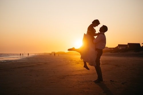 Couple enjoying their first sunset as a couple at one of the best waterfront wedding venues on Long Island Sound in Connecticut