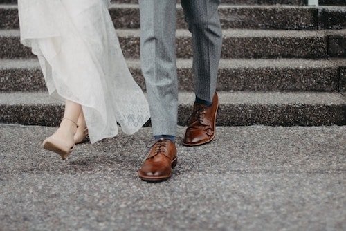Newly wed couple walking towards one of the best Connecticut wedding venues