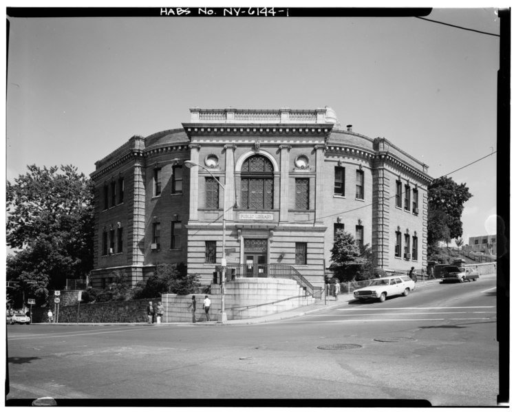 Yonkers Public Library, at the corner of Nepperhan Avenue and South Broadway, with a sign at the front, in downtown city of Yonkers, Westchester County, NY