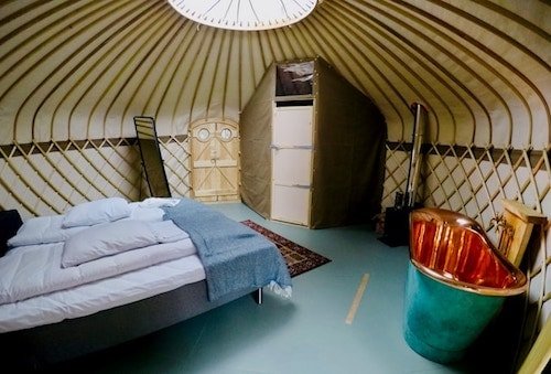 Safari-style tents with stylish furnishings in private rooms