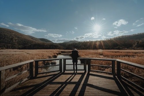 Woman enjoying the view from a platform along one of the best hiking trails in Bear Mountain State Park