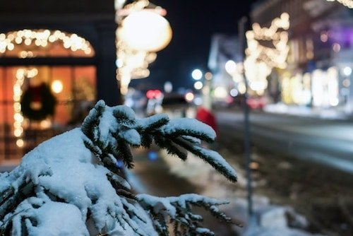 A winter evening in Woodstock, with a shop and general store behind