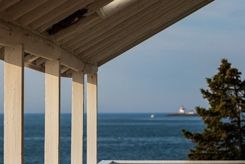 Curtis Island Lighthouse in the distance from Camden, Maine
