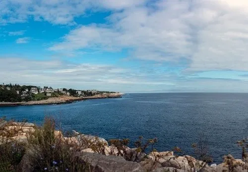 The view from Old Granite Pier overlooking Pidgeon Cove is quite scenic in Rockport MA