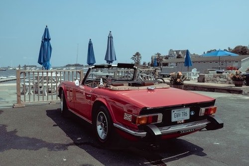 Classic convertible car at an outdoor dining spot on the beach in Norwalk, Connecticut