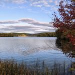 Vivid fall foliage surrounding Lake Waramaug