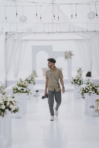 Wedding photographer walking through an incredible wedding scape