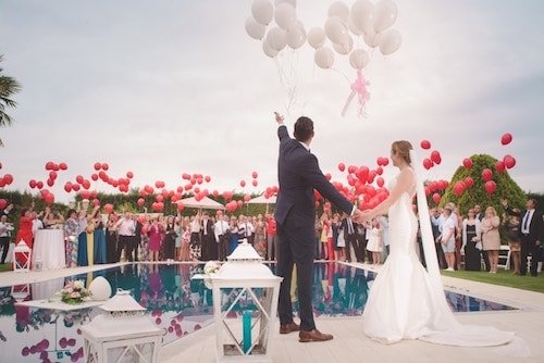 Friends and family relishing in the whole wedding experience