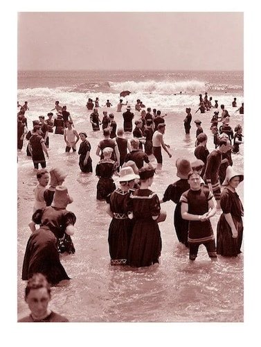 Appropriately-dressed swimmers on Coney Island beach, 1896