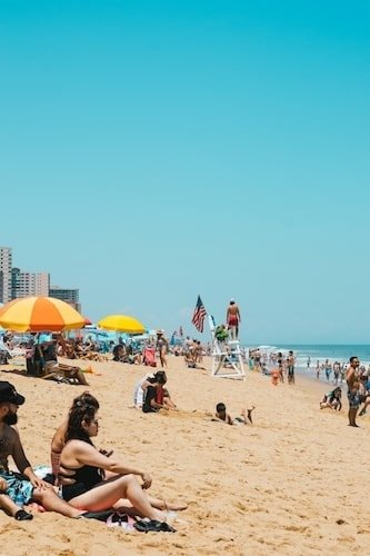Family enjoying a sunny day on the boardwalk in Ocean City, ideal for weekend getaways
