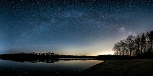 The night sky over a lake in Promised Lane State Park