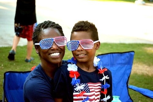 Families enjoying activities at Roger Williams Park Zoo's Summer Arts Festival