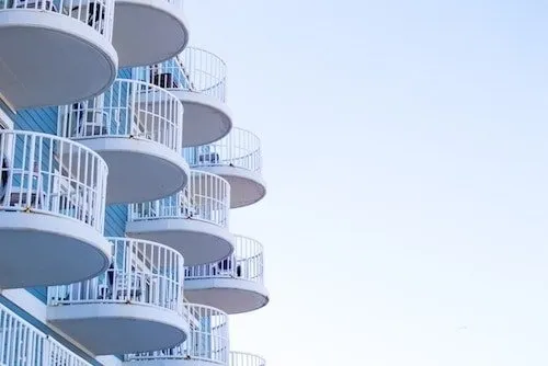 Hotel rooms overlooking the boardwalk with amusement park rides in Ocean City