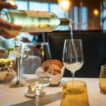 Pouring wine at one of the best fine dining restaurants in Greenwich CT