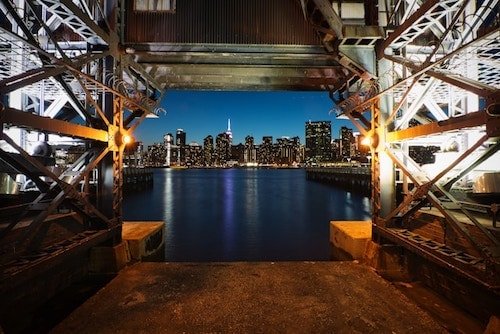 Looking across the water on a chilly night, the Empire State Building in the background