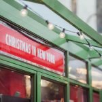 Christmas banner on a street while exploring things to do in New York at Christmas