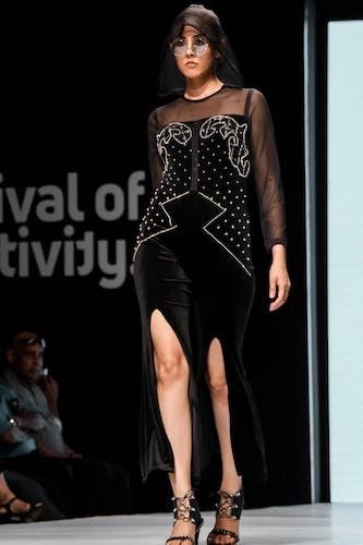 The essence of New York Fashion Week, with a model showcasing one of the stunning outfits.