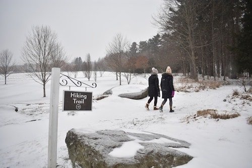 Two women walking through the scenic beauty of Stockbridge, MA, in the Berkshires, a spot with a charming small town feel