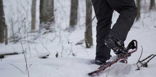 Snowshoeing on a winter adventure while on New England winter getaways
