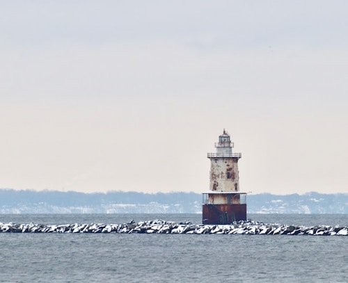 A lighthouse on Long Island Sound in southern New England in the winter season