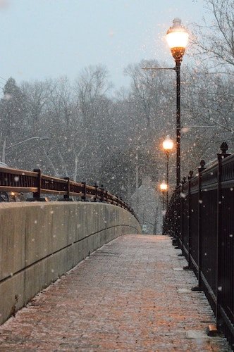 wintry walkway with hot chocolate on New England winter getaways