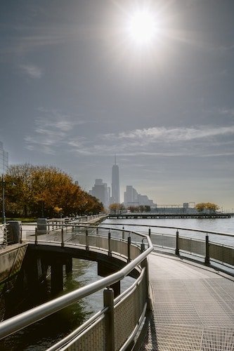 A walk near Brooklyn Bridge Park, with fall foliage along the shoreline