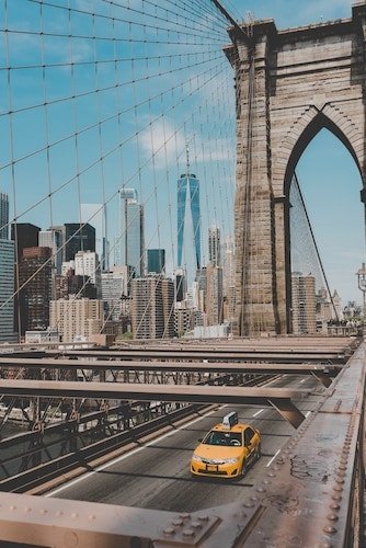 Heading across the Brooklyn Bridge to the Brooklyn Museum, the World Trade Center in the background