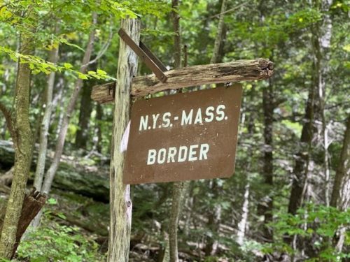 Border sign between New York State and Massachusetts in Bish Bash Falls State Park