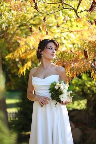 Bride exploring a beautiful outdoor wedding venue