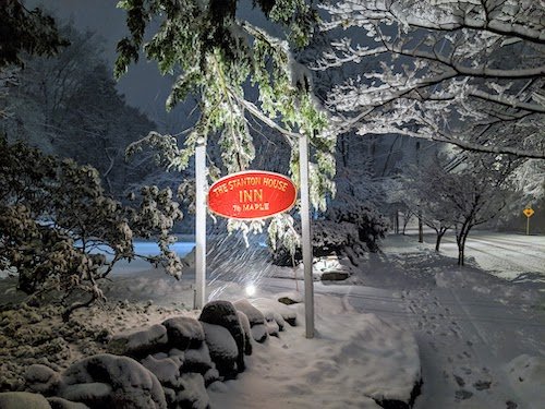 sign for Stanton House Inn during a snowstorm in January in Greenwich CT