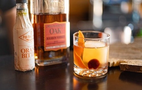 Alcohol on a bar with a mixed drink