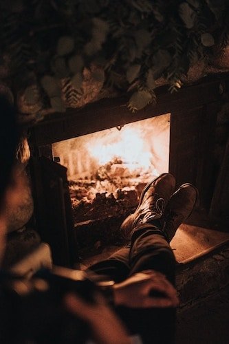 Relaxing by a fireplace in the town of Warren, CT
