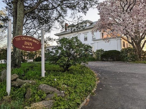 Magnolia tree blossoming in front of Stanton House Inn in April in Greenwich CT