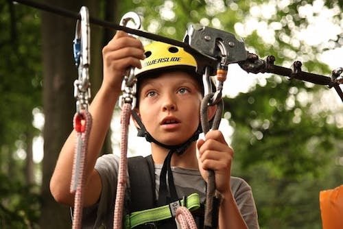 Kid having a blast on a zipline