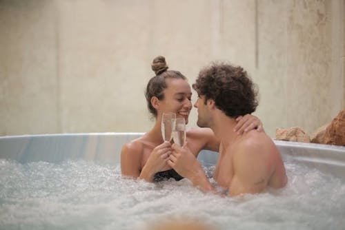 Couple enjoying spa tubs together on romantic escapes to the Northeast of the East Coast