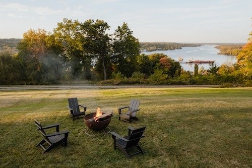 A fire pit with a view of the Hudson River Valley in Hudson, New York