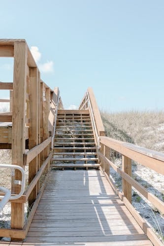 Walkway to a wonderful beach at accommodations that you can book online. Start planning now!