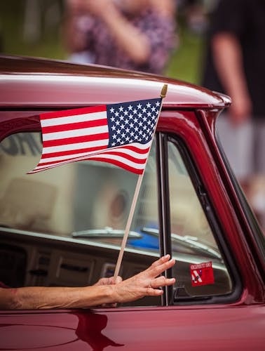 Waving from a Memorial Day parade starting at the new shopping plaza, Long Hill Market, with the American Legion