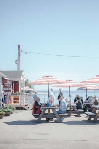 Picnic tables and umbrellas at a no-frills lobster shack in CT