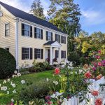 Dahlias and flowers blooming in front of a charming Greenwich home