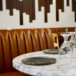 Restaurant booth at one of the best restaurants listed in this March foodie guide