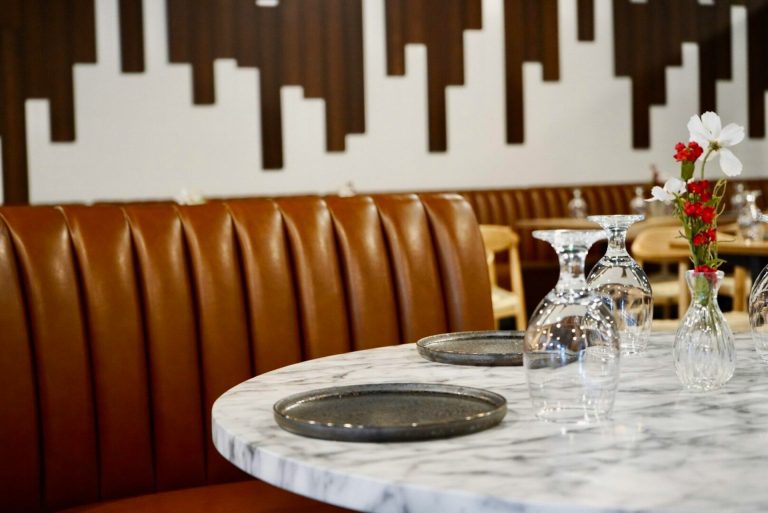 Restaurant booth at one of the best restaurants listed in this March foodie guide